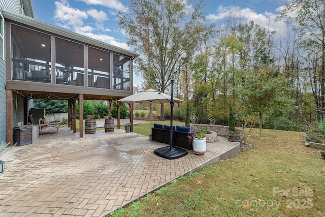 view of patio / terrace featuring a sunroom