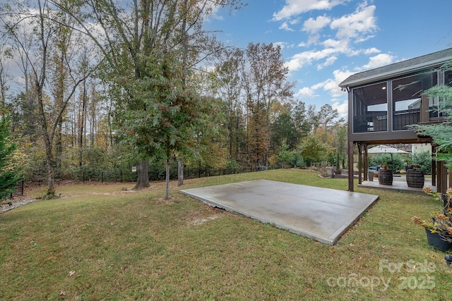 view of yard with a patio and a sunroom