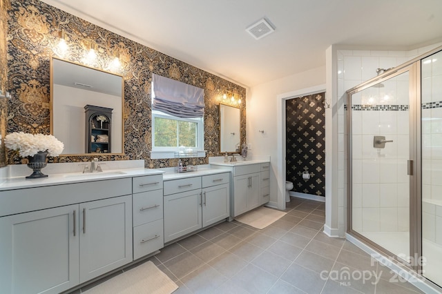 full bath featuring visible vents, a shower stall, toilet, tile patterned floors, and vanity