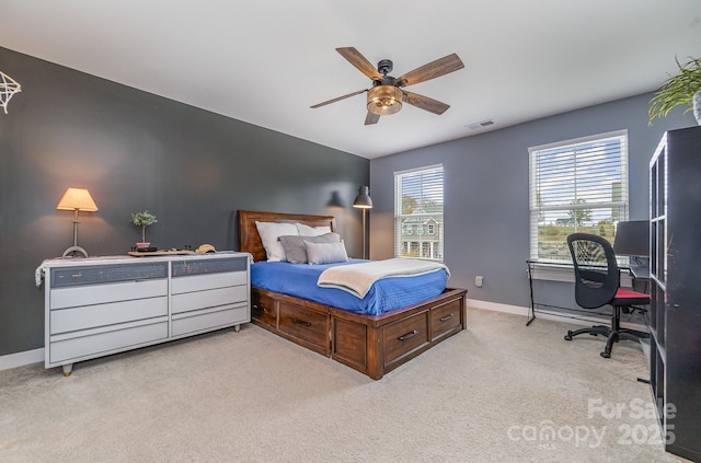 bedroom featuring visible vents, baseboards, a ceiling fan, and carpet flooring