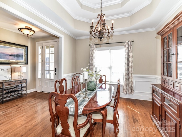 816 Springs Rd, Dallas, NC 28034 - dining area featuring a raised ceiling, plenty of natural light, a chandelier, light wood-type flooring, and crown molding