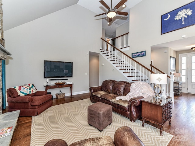 816 Springs Rd, Dallas, NC 28034 - living room featuring wood finished floors, high vaulted ceiling, stairs, a ceiling fan, and baseboards