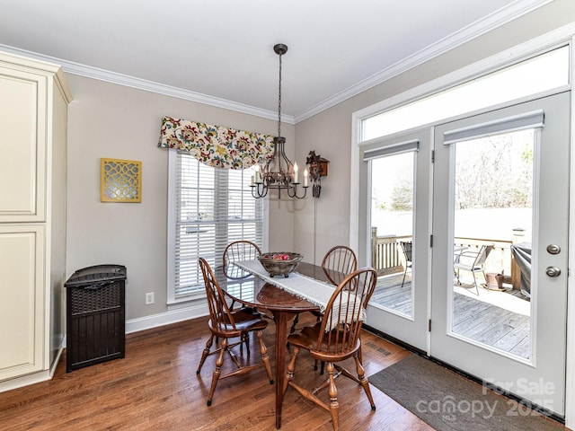 816 Springs Rd, Dallas, NC 28034 - dining space with dark wood-type flooring, a chandelier, crown molding, and baseboards