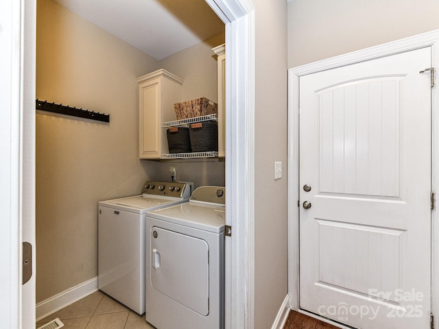 816 Springs Rd, Dallas, NC 28034 - laundry area with separate washer and dryer, baseboards, cabinet space, and light tile patterned floors