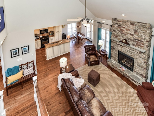 816 Springs Rd, Dallas, NC 28034 - living area with a ceiling fan, dark wood-style floors, lofted ceiling, and a stone fireplace