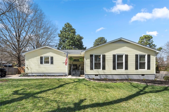 single story home featuring a front yard and fence