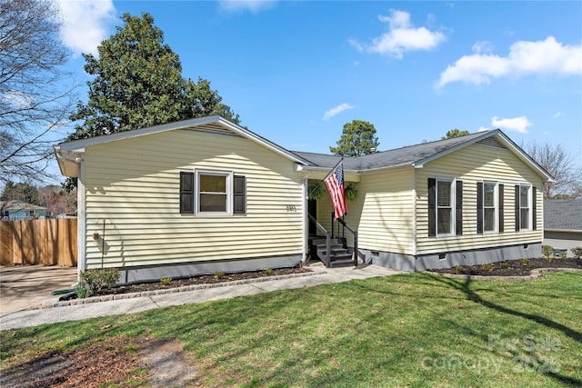 view of front of home featuring crawl space, fence, a front yard, and entry steps