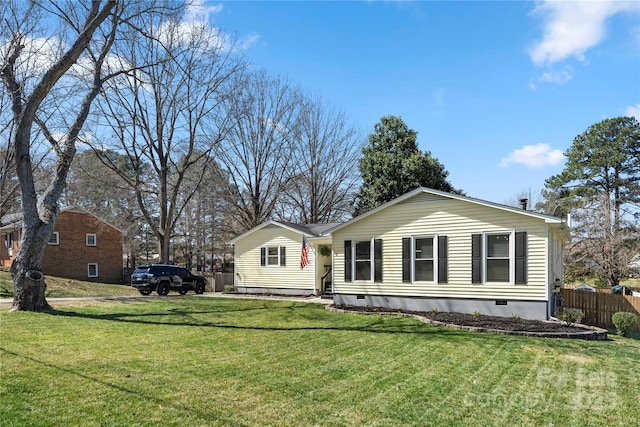 view of front of property with crawl space, a front lawn, and fence