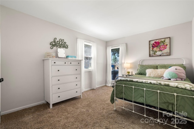 bedroom featuring baseboards and carpet floors