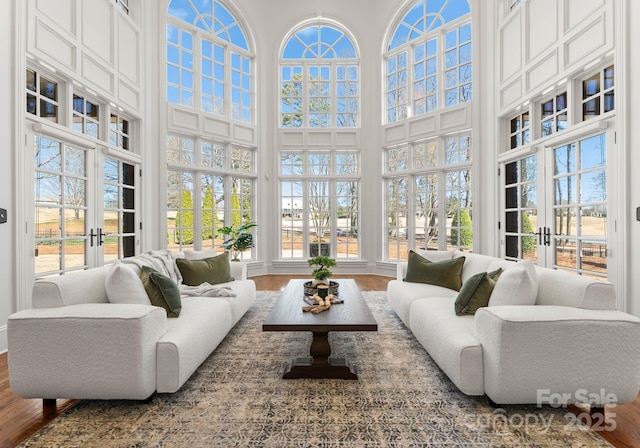 sunroom / solarium featuring a wealth of natural light and french doors