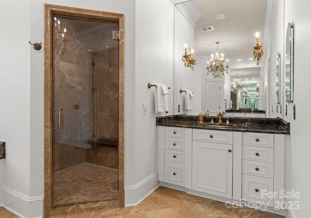 bathroom featuring visible vents, a shower stall, vanity, and baseboards