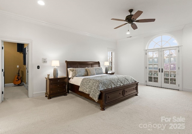 bedroom featuring crown molding, multiple windows, and carpet flooring