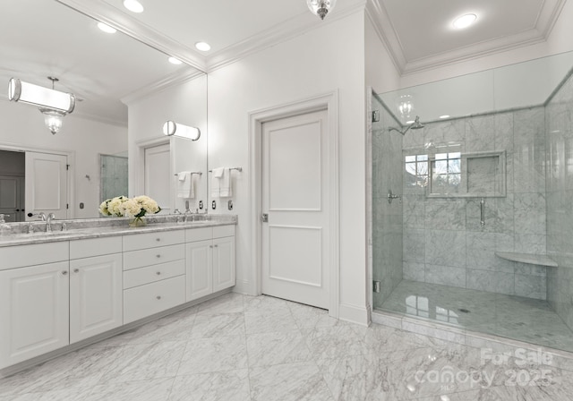 full bath featuring a shower stall, ornamental molding, and a sink