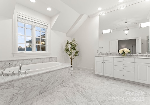 full bathroom featuring marble finish floor, a sink, double vanity, baseboards, and a bath