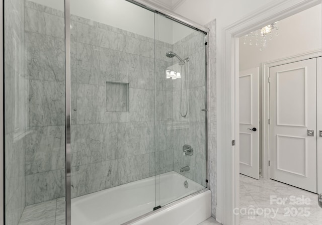 bathroom featuring combined bath / shower with glass door