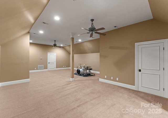 unfurnished living room with vaulted ceiling, visible vents, and ceiling fan