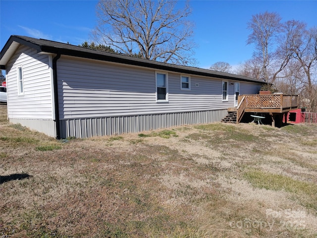 view of property exterior featuring a wooden deck