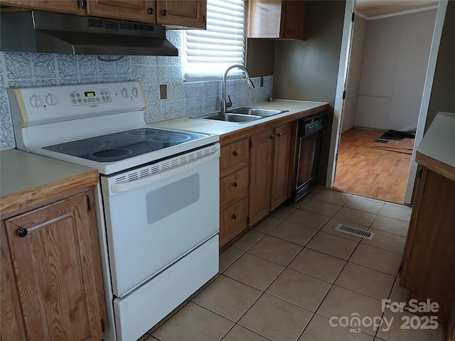 kitchen with visible vents, electric range, a sink, under cabinet range hood, and dishwasher