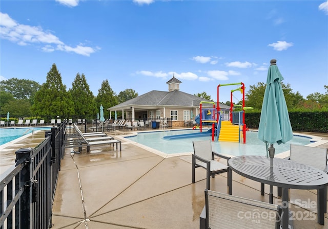 8806 Cool Meadow Dr, Huntersville, NC 28078 - pool featuring a water play area, fence, playground community, and a patio area