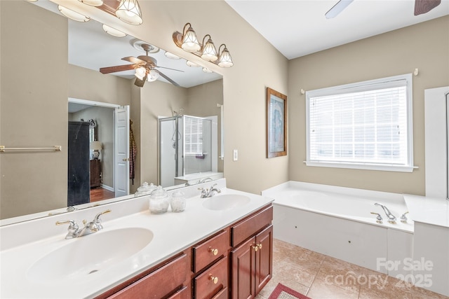 bathroom with a sink, ceiling fan, and a bath