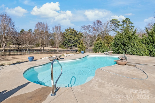 view of pool with a patio, a fenced in pool, and fence private yard