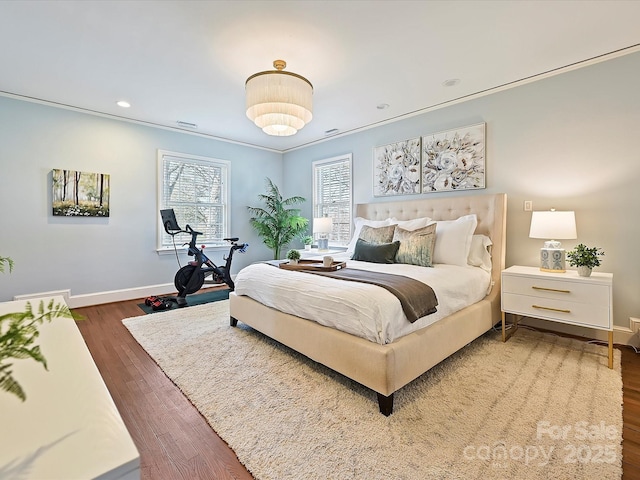 bedroom with recessed lighting, baseboards, dark wood-type flooring, and crown molding