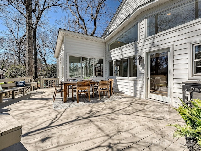 wooden deck with outdoor dining area