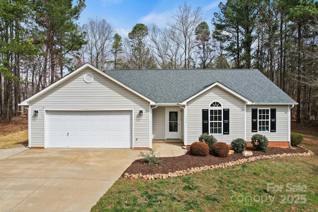 ranch-style house featuring an attached garage, driveway, and roof with shingles