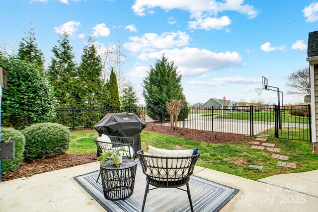 view of patio / terrace featuring a grill and fence