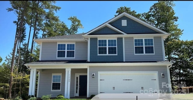 view of front of home featuring an attached garage and driveway