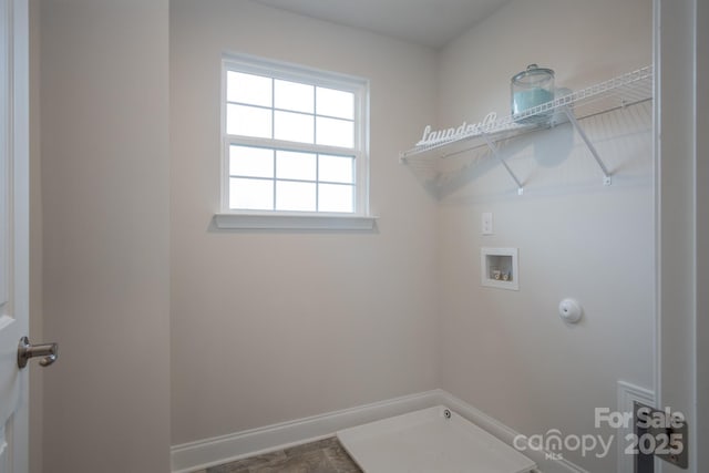 laundry area featuring washer hookup, laundry area, baseboards, and hookup for a gas dryer