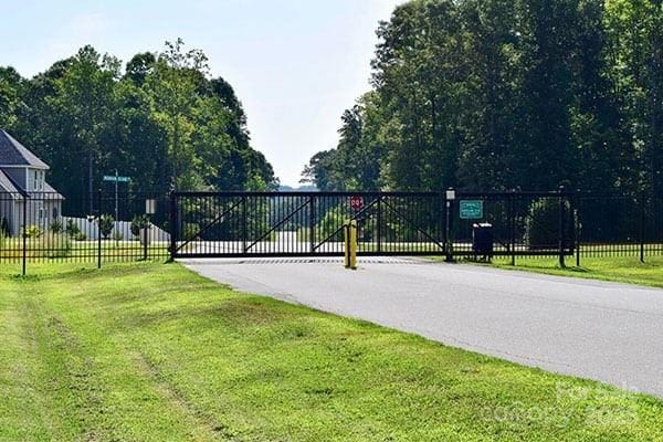 view of street with a gated entry