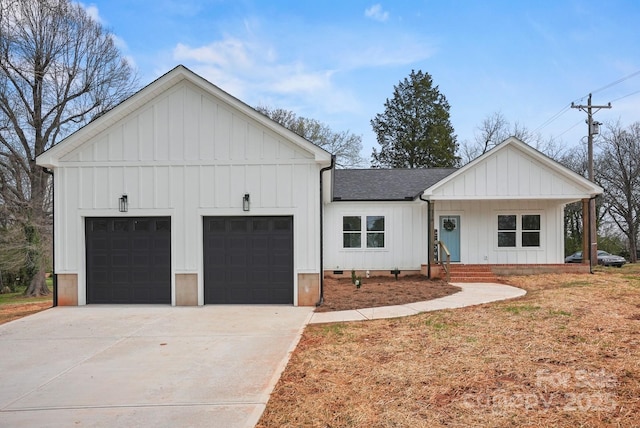 modern farmhouse with board and batten siding, concrete driveway, a garage, and roof with shingles