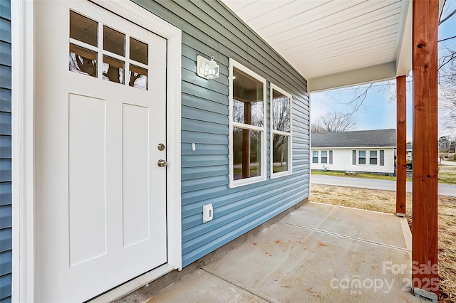 doorway to property featuring a porch