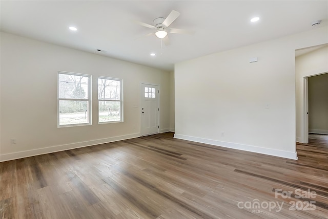 foyer entrance with recessed lighting, baseboards, and wood finished floors