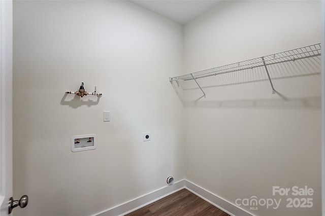 laundry area with washer hookup, dark wood finished floors, baseboards, hookup for an electric dryer, and laundry area