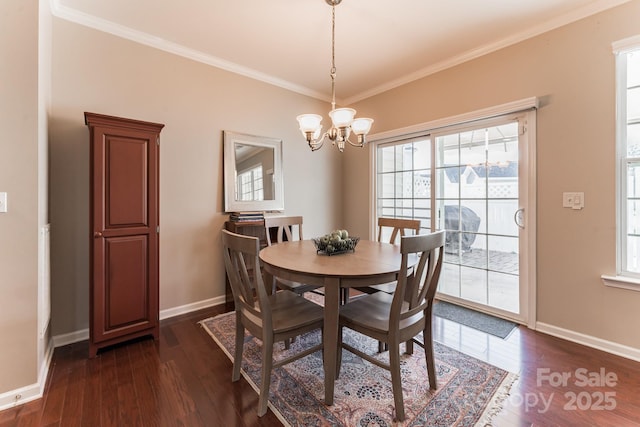 dining space featuring an inviting chandelier, baseboards, dark wood-style flooring, and ornamental molding