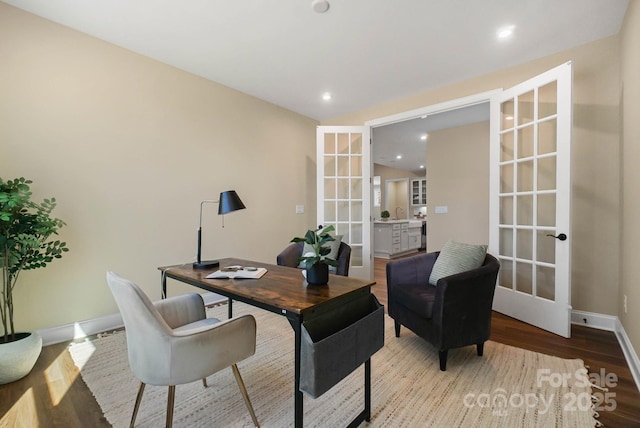 home office featuring recessed lighting, french doors, baseboards, and wood finished floors