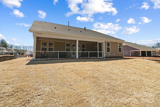 back of house with a sunroom