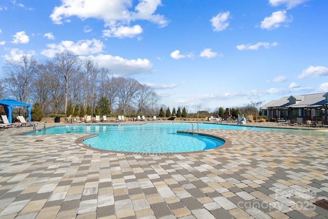 community pool featuring a patio area