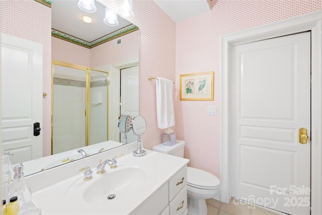 bathroom with tile patterned flooring, a shower stall, wallpapered walls, toilet, and vanity