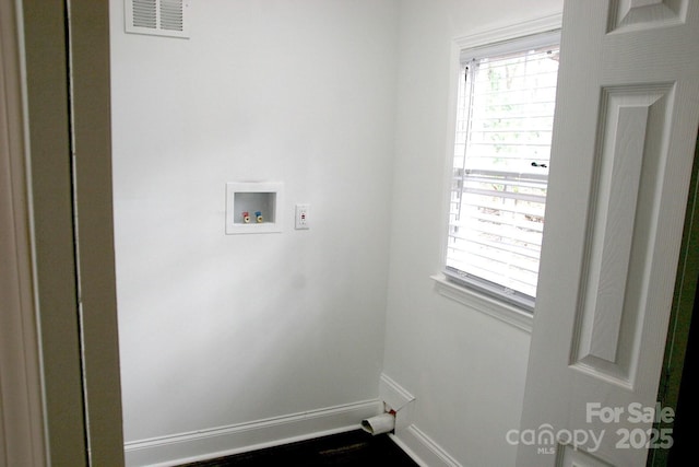 laundry room featuring washer hookup, laundry area, baseboards, and visible vents