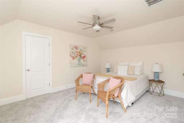 carpeted bedroom featuring visible vents, lofted ceiling, baseboards, and ceiling fan