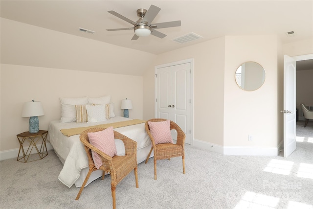 carpeted bedroom featuring vaulted ceiling, baseboards, visible vents, and ceiling fan