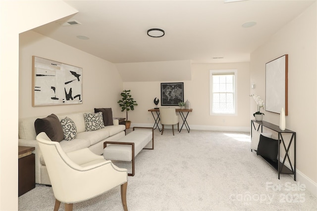 living area featuring vaulted ceiling, carpet, visible vents, and baseboards