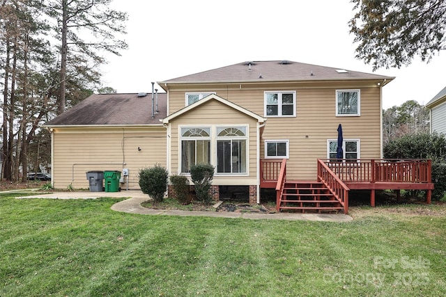 back of house with a deck and a yard