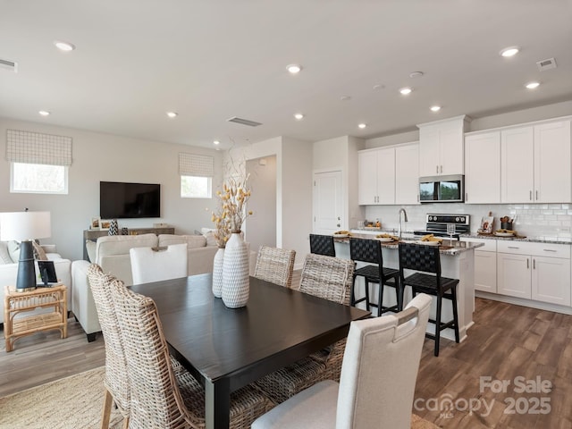 dining area with visible vents, recessed lighting, and dark wood-style flooring