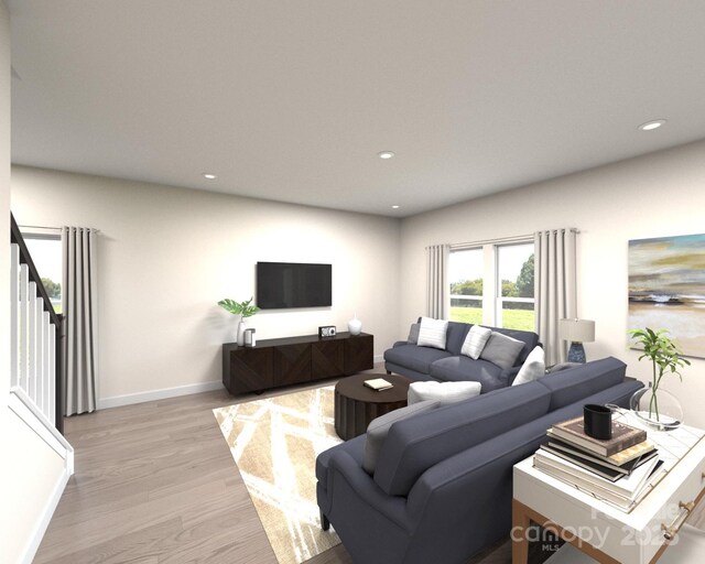 living room featuring recessed lighting, stairs, light wood-type flooring, and baseboards