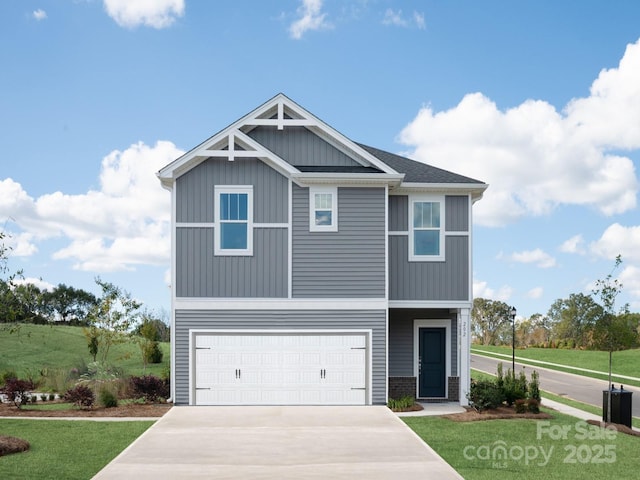 view of front facade featuring a front yard, an attached garage, board and batten siding, and driveway