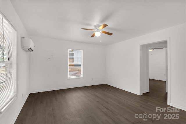 unfurnished room featuring dark wood finished floors, baseboards, a wall mounted air conditioner, and a ceiling fan